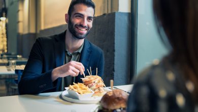 Portrait,Of,A,Bearded,Young,Man,Eating,Chips,And,Sandwiches