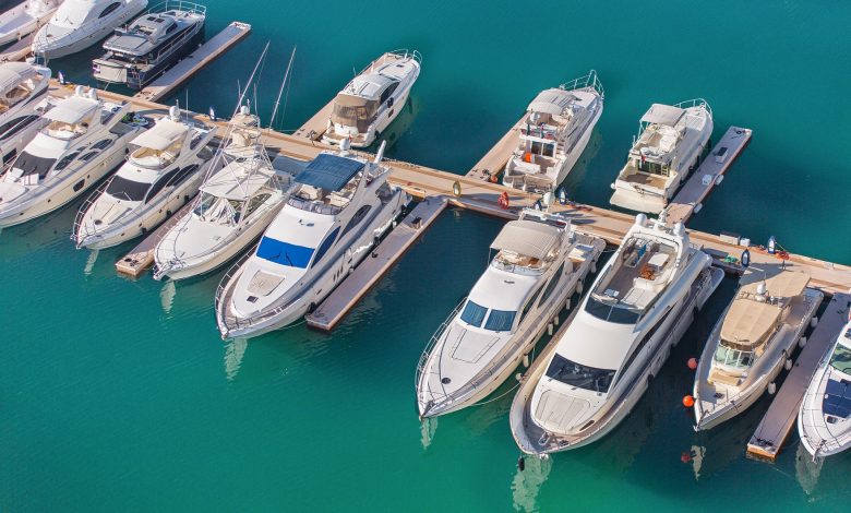 Aerial view on yachts. White boats are parked in yacht club.