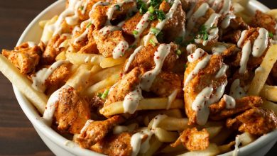 A,Closeup,View,Of,A,Bowl,Of,Chicken,Shawarma,Fries.