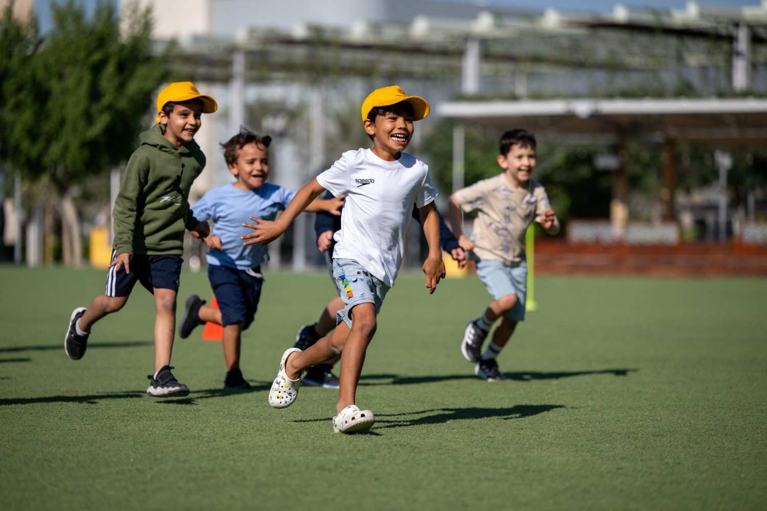 High-energy sports sessions led by AFC coaches bring big outdoor fun to the Winter Edition camps.